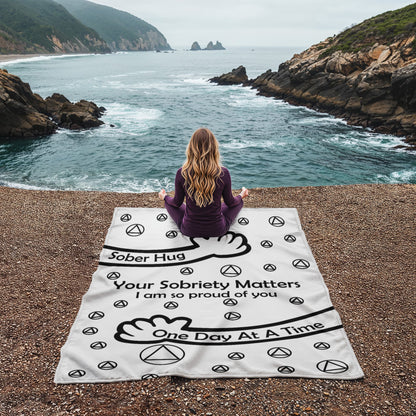 Slogan blanket, white with black 'Your Sobriety Matters' message and peace icons