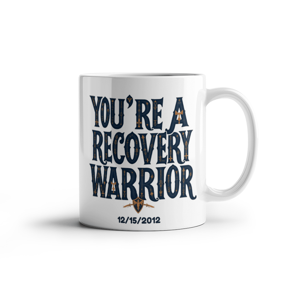 White ceramic mug with a recovery warrior design and date printed on the front