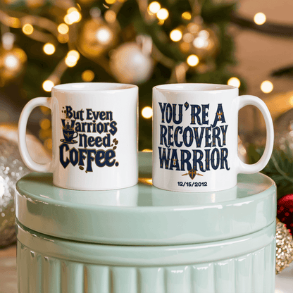 Pair of white mugs with recovery warrior and coffee-themed designs