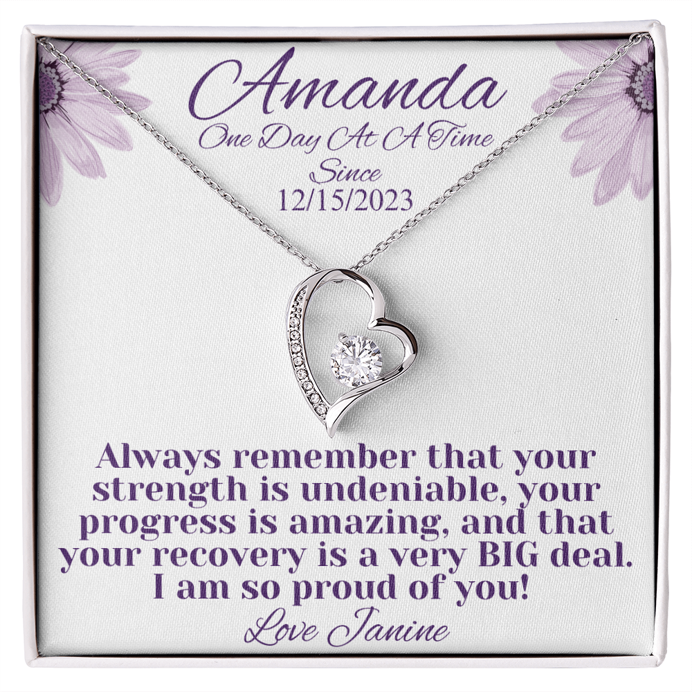 Silver heart recovery necklace with diamond-like center and side stones, chain included