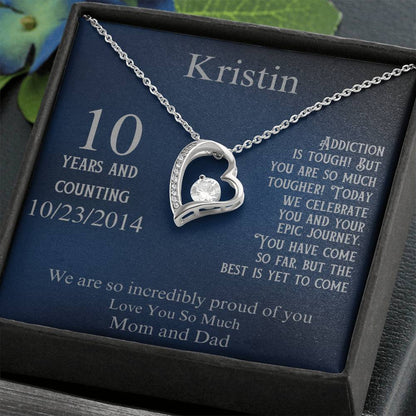Silver heart pendant necklace in gift box, with 10 years and date 10/23/2014 on card