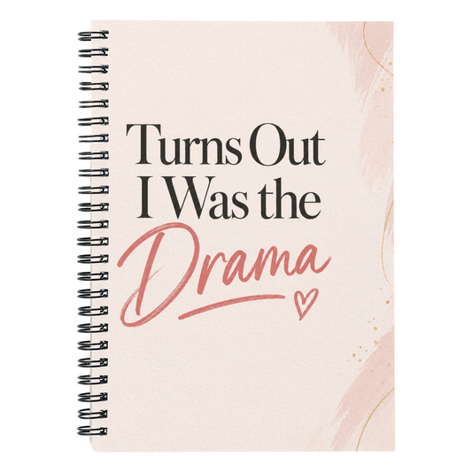 Spiral-bound recovery journal with pink cover and 'Turns Out I Was the Drama' title