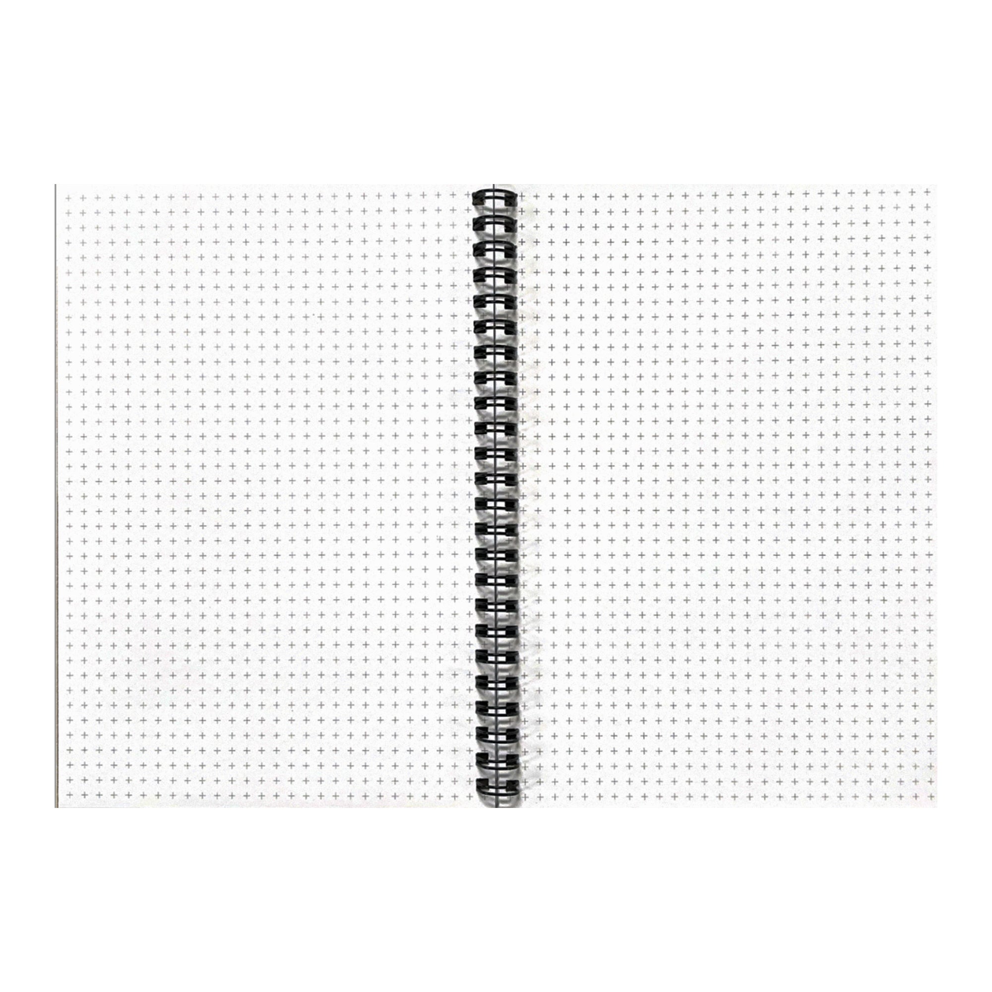 Spiral-bound journal pages with dotted grid pattern