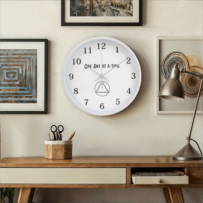 Recovery wall clock with white face and natural wood frame, black numerals and hands