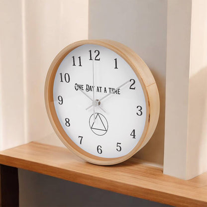 Natural wood round wall clock with “One Day At A Time” text, black hour markers, and hands