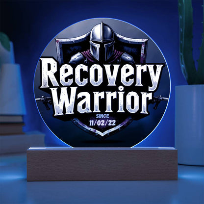 LED circle plaque with knight helmet graphic and “Recovery Warrior” on wooden base