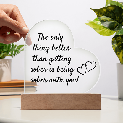 LED heart acrylic plaque with quote and heart icon on wood base, hand adjusting