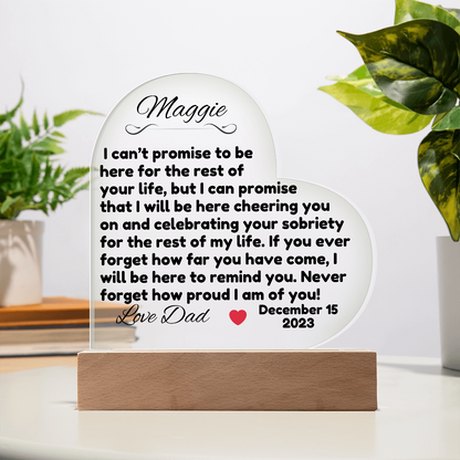 Acrylic LED heart sign with Maggie message on wooden base, clear stand support