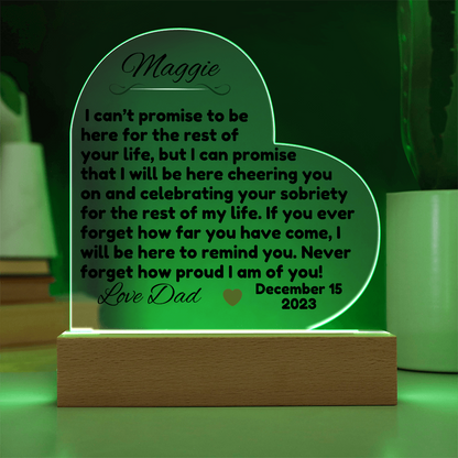 Acrylic LED heart sign with Maggie message, green glow outline on wooden base