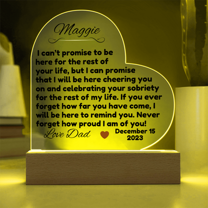 Acrylic LED heart sign with Maggie message, yellow glow outline on wooden base