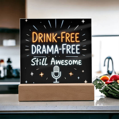Glowing LED quote plaque with “DRINK-FREE DRAMA-FREE Still Awesome” and mic icon