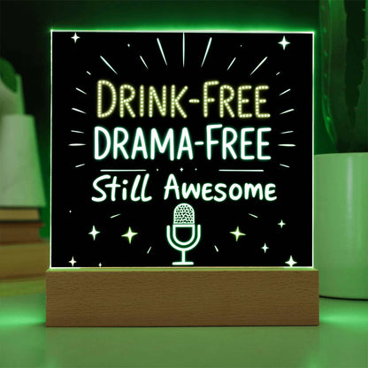 Glowing LED quote plaque with green text “DRINK-FREE DRAMA-FREE” and mic icon on base