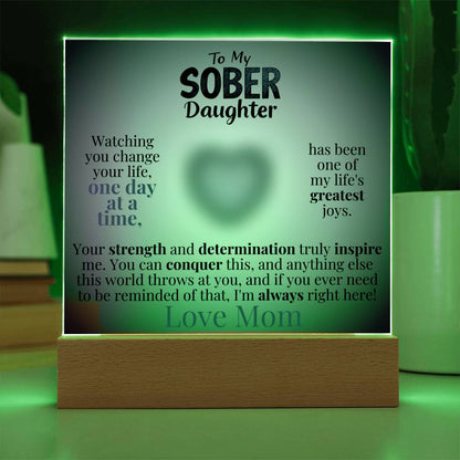Light-up acrylic plaque with wooden base, green glow border and heart message