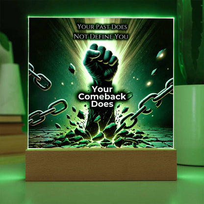 LED plaque with green glow border, fist and chains graphic on wood base