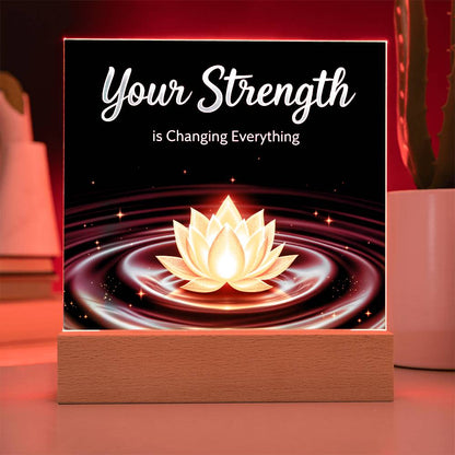 LED strength plaque with “Your Strength” and glowing lotus in red ring, on wood base
