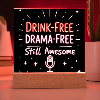 Glowing LED quote plaque with red text “DRINK-FREE DRAMA-FREE” and mic icon on base