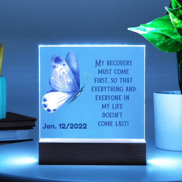 Acrylic LED sobriety date gift on wood base, glowing white border with purple butterfly and Jan. 12/2022