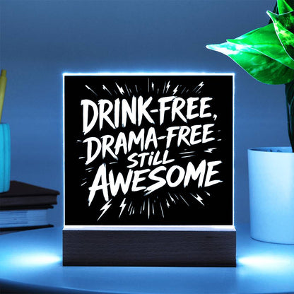 LED plaque with black panel and white slogan DRINK-FREE, DRAMA-FREE, STILL AWESOME, green glow light