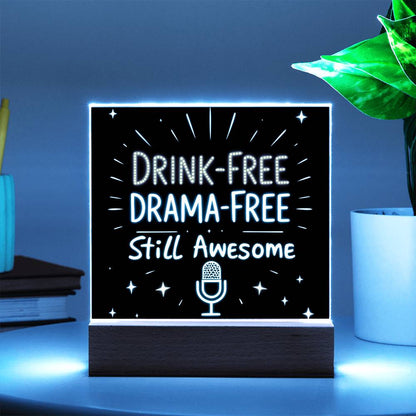 Glowing LED quote plaque with “DRINK-FREE DRAMA-FREE” and microphone icon on wood base