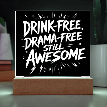 LED plaque with black panel and white slogan DRINK-FREE, DRAMA-FREE, STILL AWESOME, green-lit frame