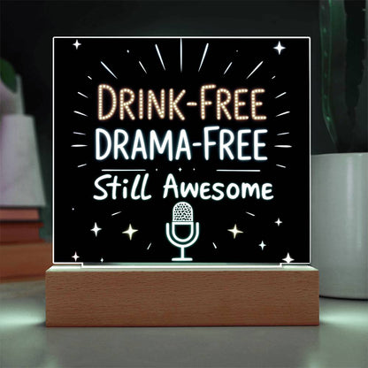 Glowing LED quote plaque with “DRINK-FREE DRAMA-FREE” and mic icon, wood base
