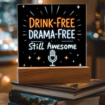 Glowing LED quote plaque with “DRINK-FREE DRAMA-FREE” and mic icon on wooden base