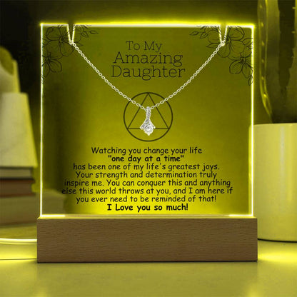 LED acrylic plaque with necklace, yellow glowing border and heart pendant on chain