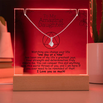 LED acrylic plaque with necklace, red glowing border and heart pendant on chain