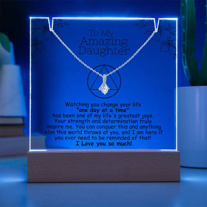 LED acrylic plaque with necklace, blue glowing border and heart pendant on chain