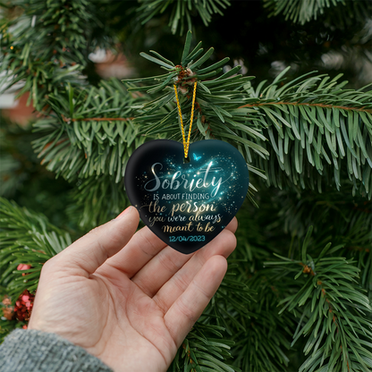 High-gloss dark heart ornament in hand with gold cord, blue butterfly, and 12/04/2023