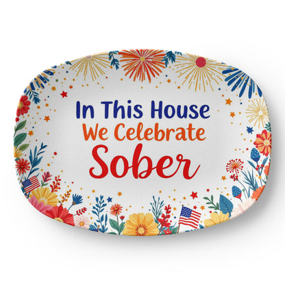 Oval serving platter with “In This House We Celebrate Sober” surrounded by fireworks and stars