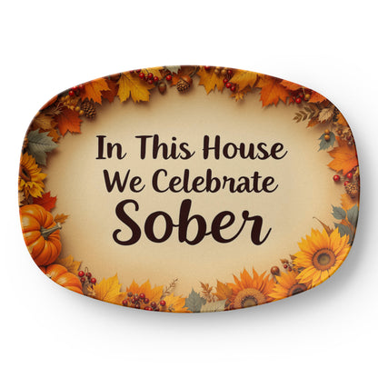 Oval serving platter with autumn leaf border and text "In This House We Celebrate Sober"