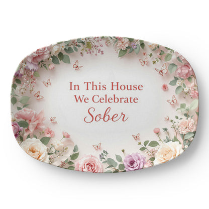 Oval serving platter with floral border and 'In This House We Celebrate Sober' text
