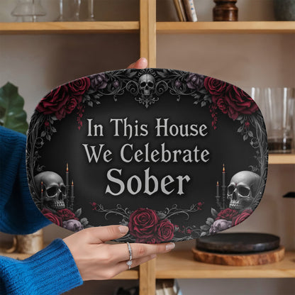 Oval serving platter with gothic quote, skulls, and red roses held up for display