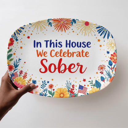 Oval serving platter with “In This House We Celebrate Sober” and fireworks floral pattern