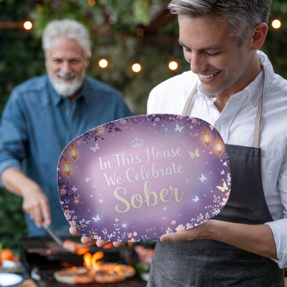 Purple oval gift tray with 'In This House We Celebrate Sober' lettering and lantern motifs
