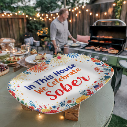 Oval platter with “In This House We Celebrate Sober” text and red, blue, and gold fireworks