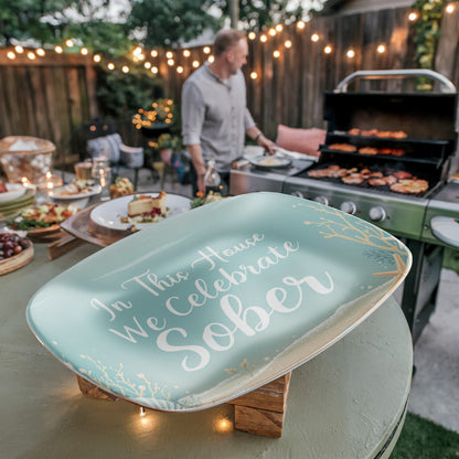 Seafoam oval platter on wooden stand with coastal text “In This House We Celebrate Sober”