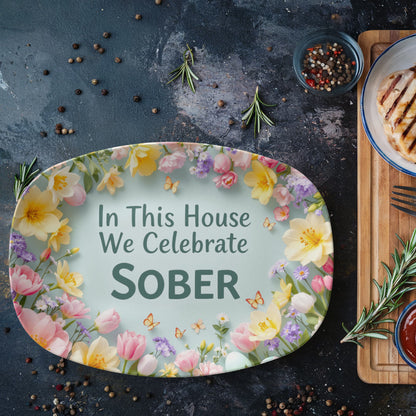 Serving platter with floral wreath border and teal message: “In This House We Celebrate SOBER”