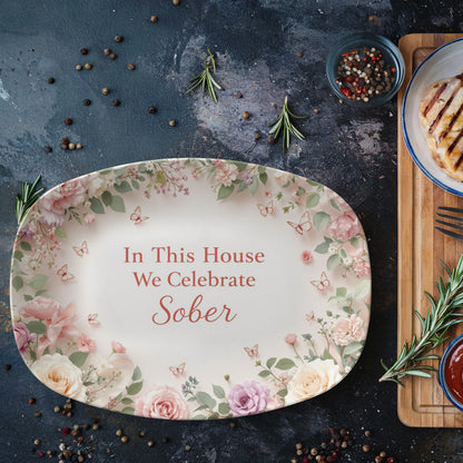 Oval serving platter with floral border and 'In This House We Celebrate Sober' quote