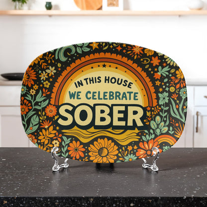 Decorative oval platter with “SOBER” lettering and decorative floral border design
