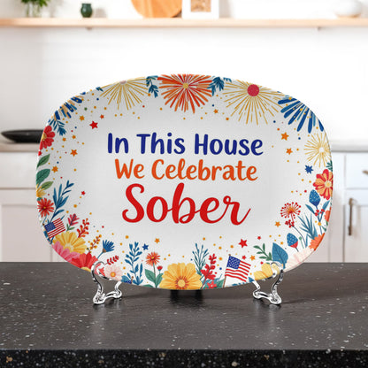 Oval “In This House We Celebrate Sober” platter with colorful fireworks and botanical border