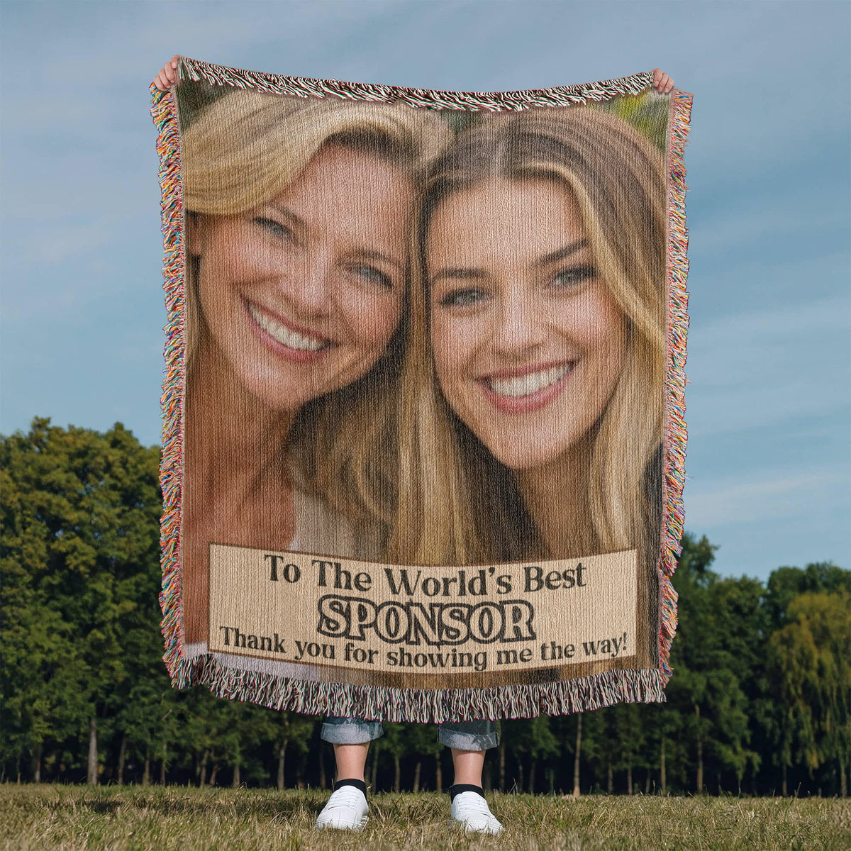 Fringed photo throw blanket outdoors featuring two women portraits and sponsor thank-you text