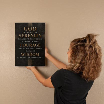 Black vertical canvas wall art with gold Serenity Prayer text mounted on wall.
