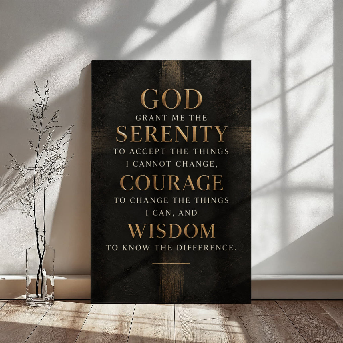 Black vertical canvas wall art with gold Serenity Prayer text, standing on floor.