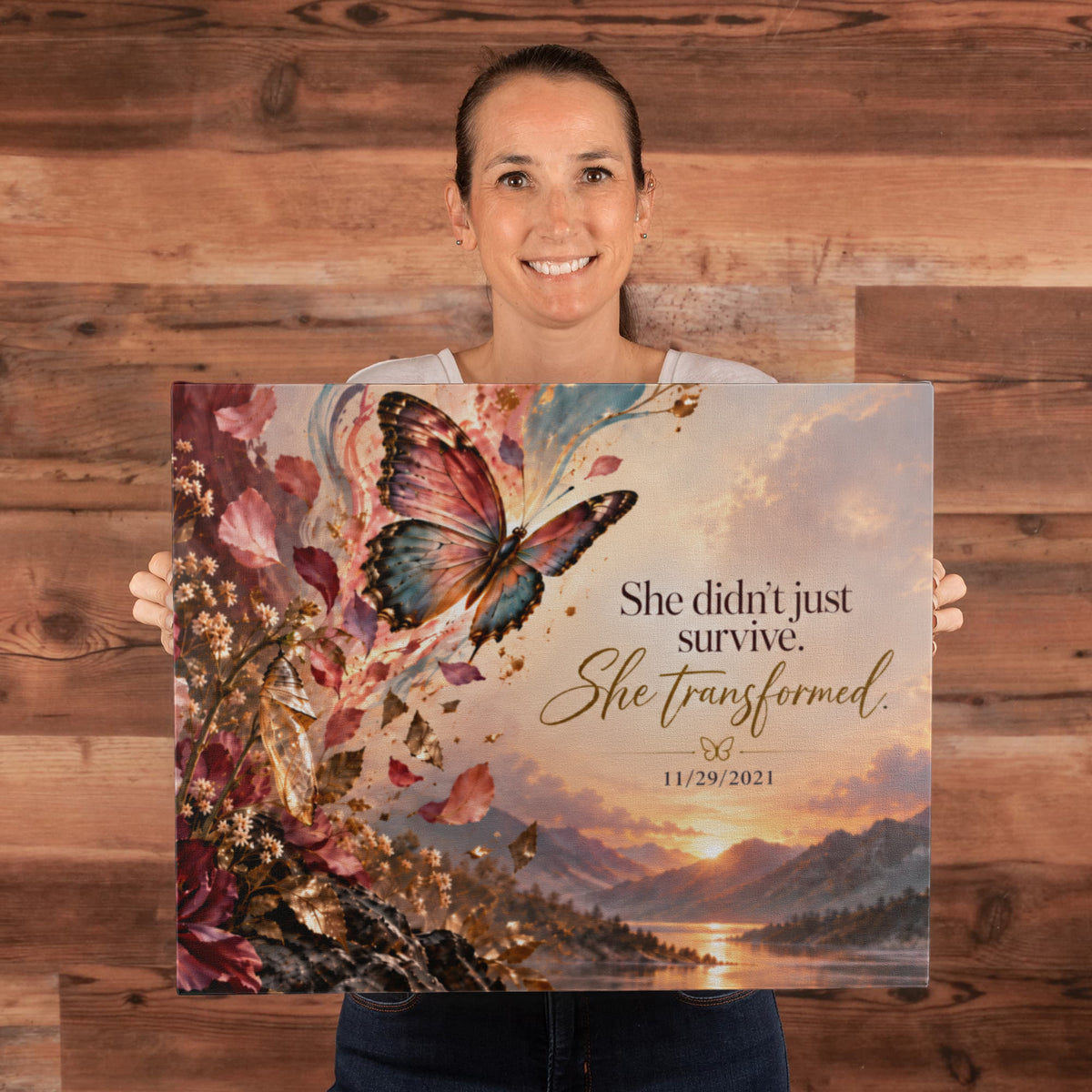 Custom recovery date canvas held up, showing butterfly, flowers, quote, and date