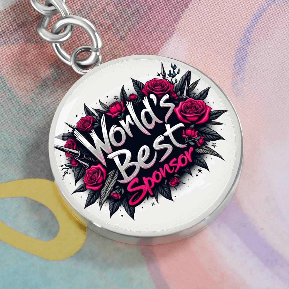 Round silver keychain with rose graphic and “World’s Best Sponsor” text front