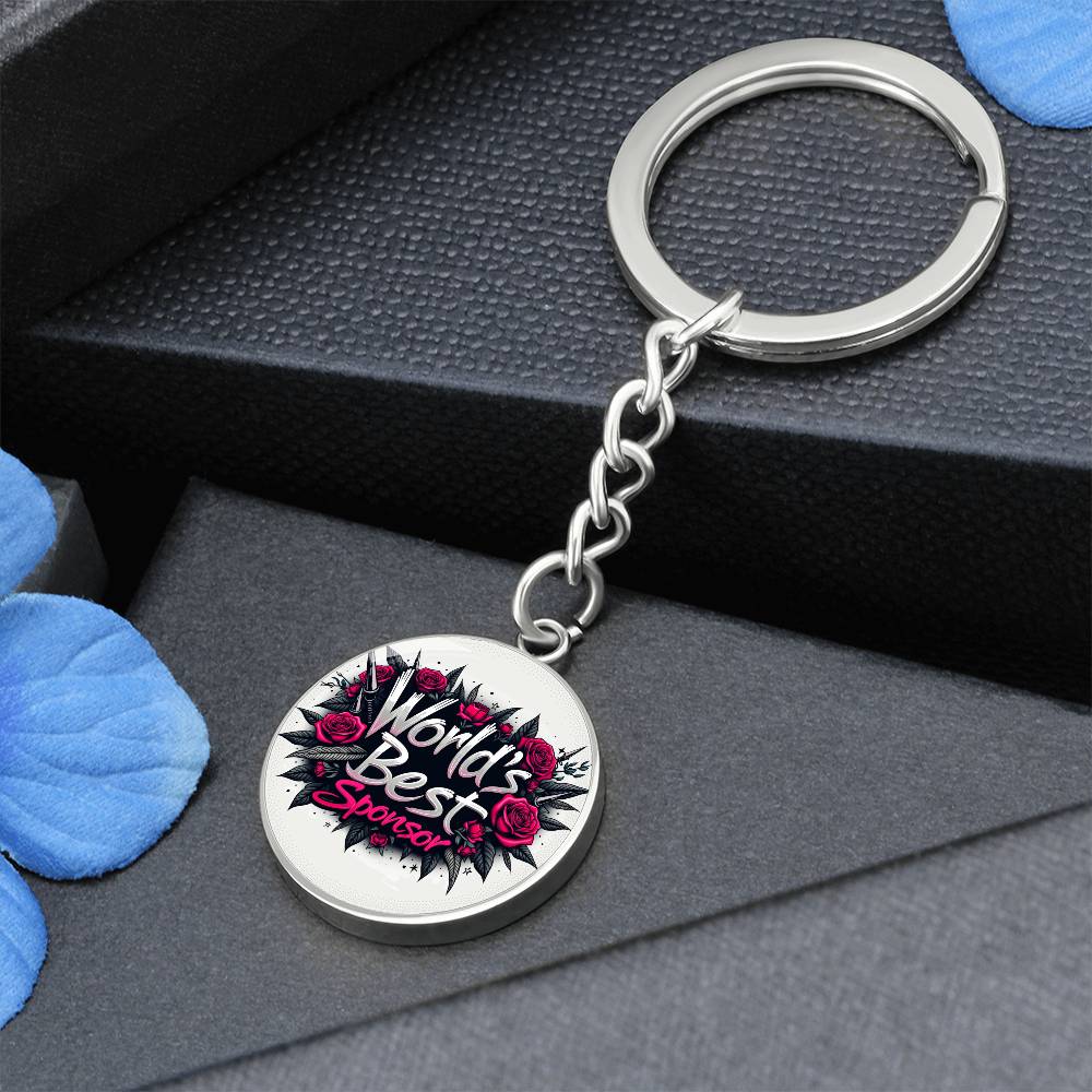 Round keychain charm with rose graphic, “World’s Best Sponsor” text on dark chain