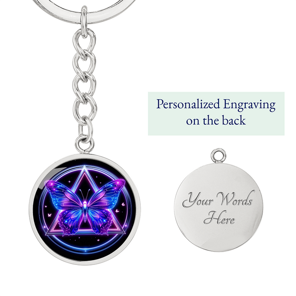 Silver-tone keychain with round glowing butterfly front and engraved back panel