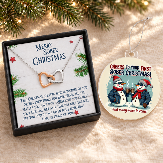 Christmas gift set with a silver chain and interlocking heart pendants, message card, and illustrated ornament